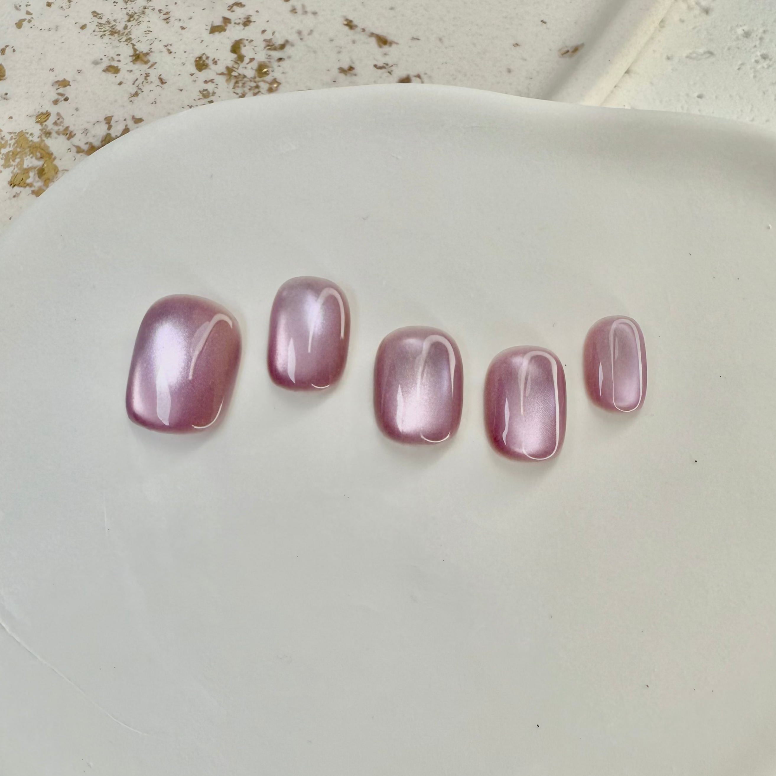 Pink Mist cat eye press-on nails in soft pastel pink with magnetic shimmer