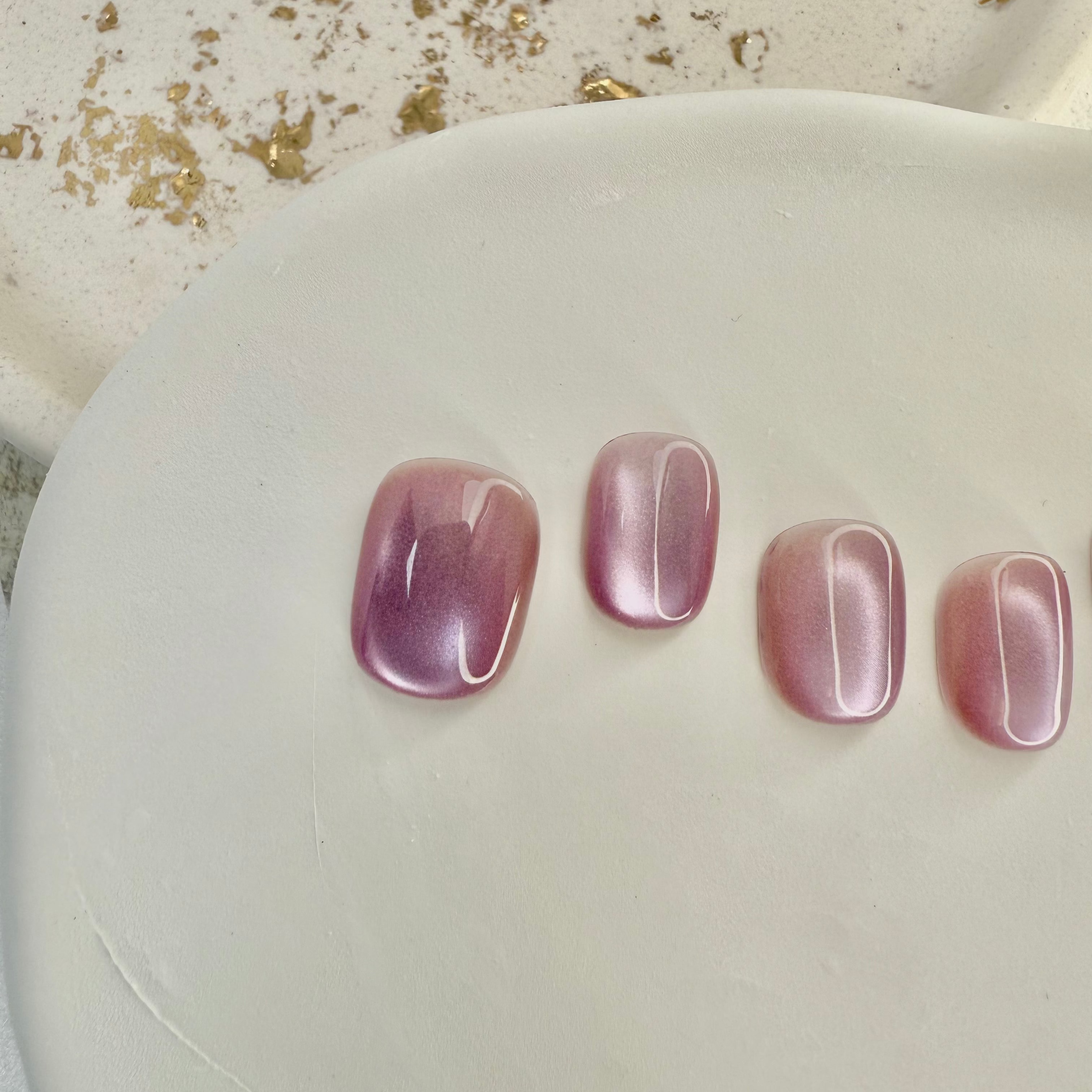 Pink Mist cat eye press-on nails in soft pastel pink with magnetic shimmer