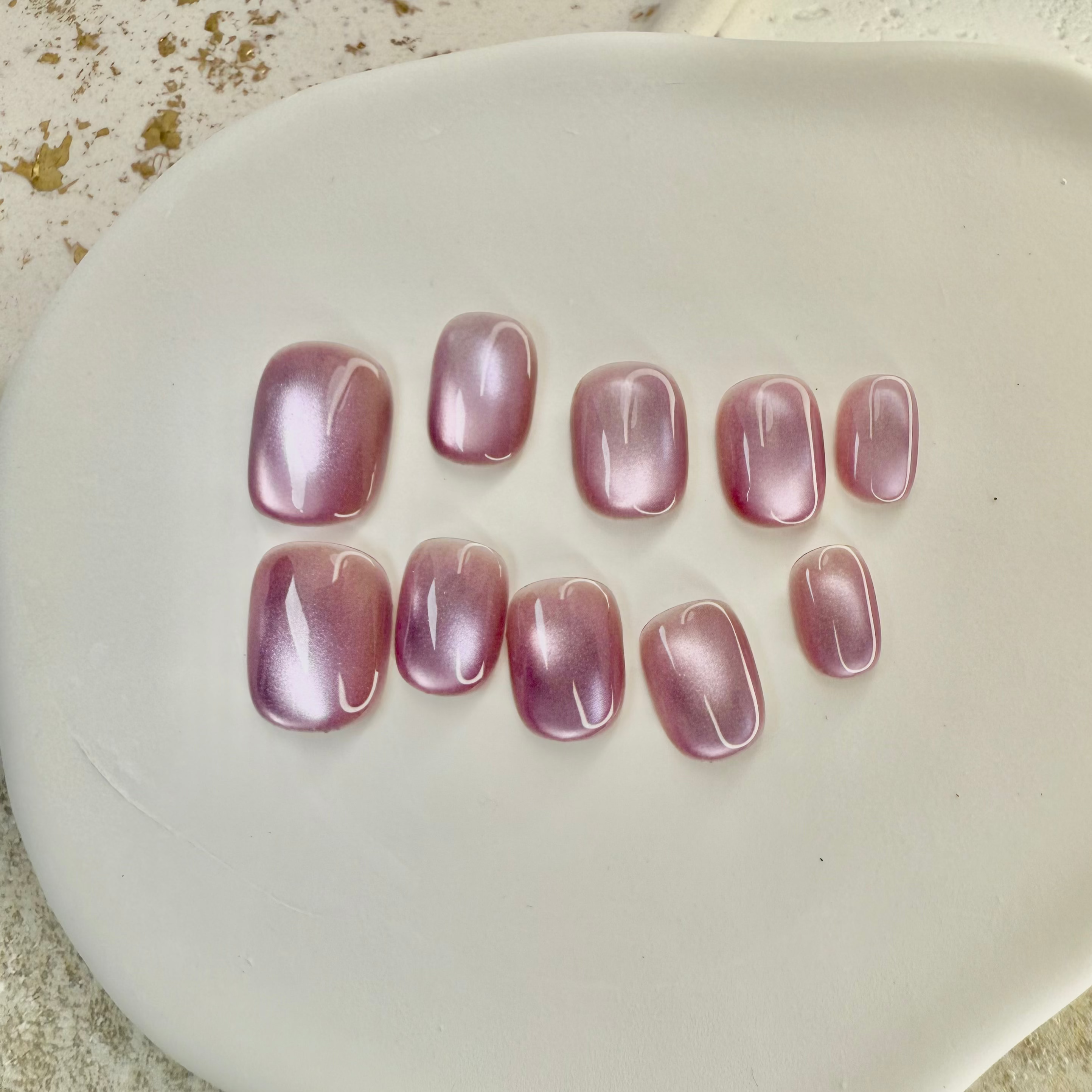 Pink Mist cat eye press-on nails in soft pastel pink with magnetic shimmer