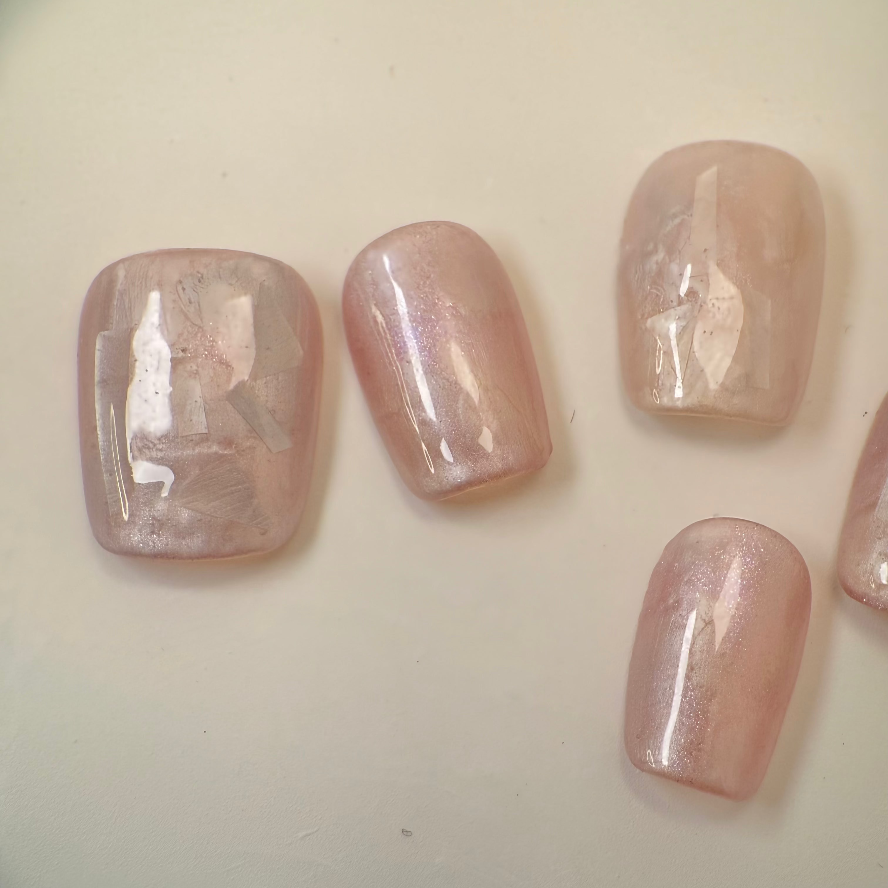 Handmade silver cat-eye press-on nails with shimmering magnetic effect, Vlei Nails Cape Town South Africa.
