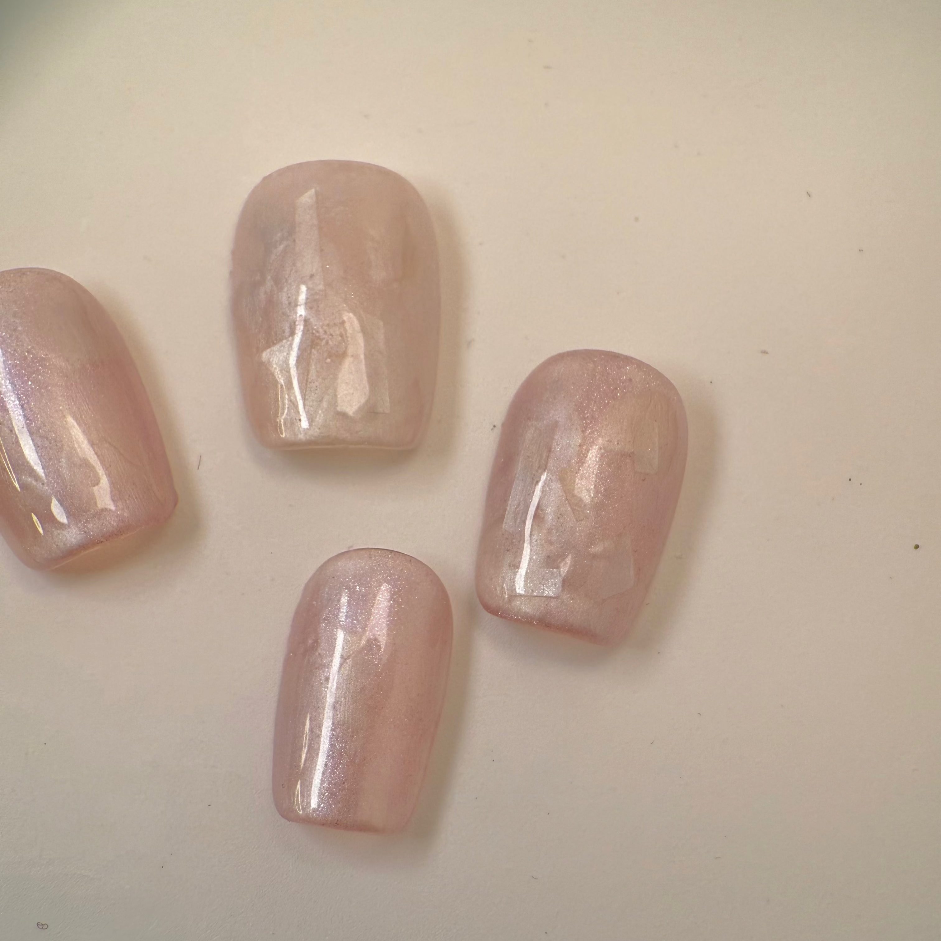 Handmade silver cat-eye press-on nails with shimmering magnetic effect, Vlei Nails Cape Town South Africa.