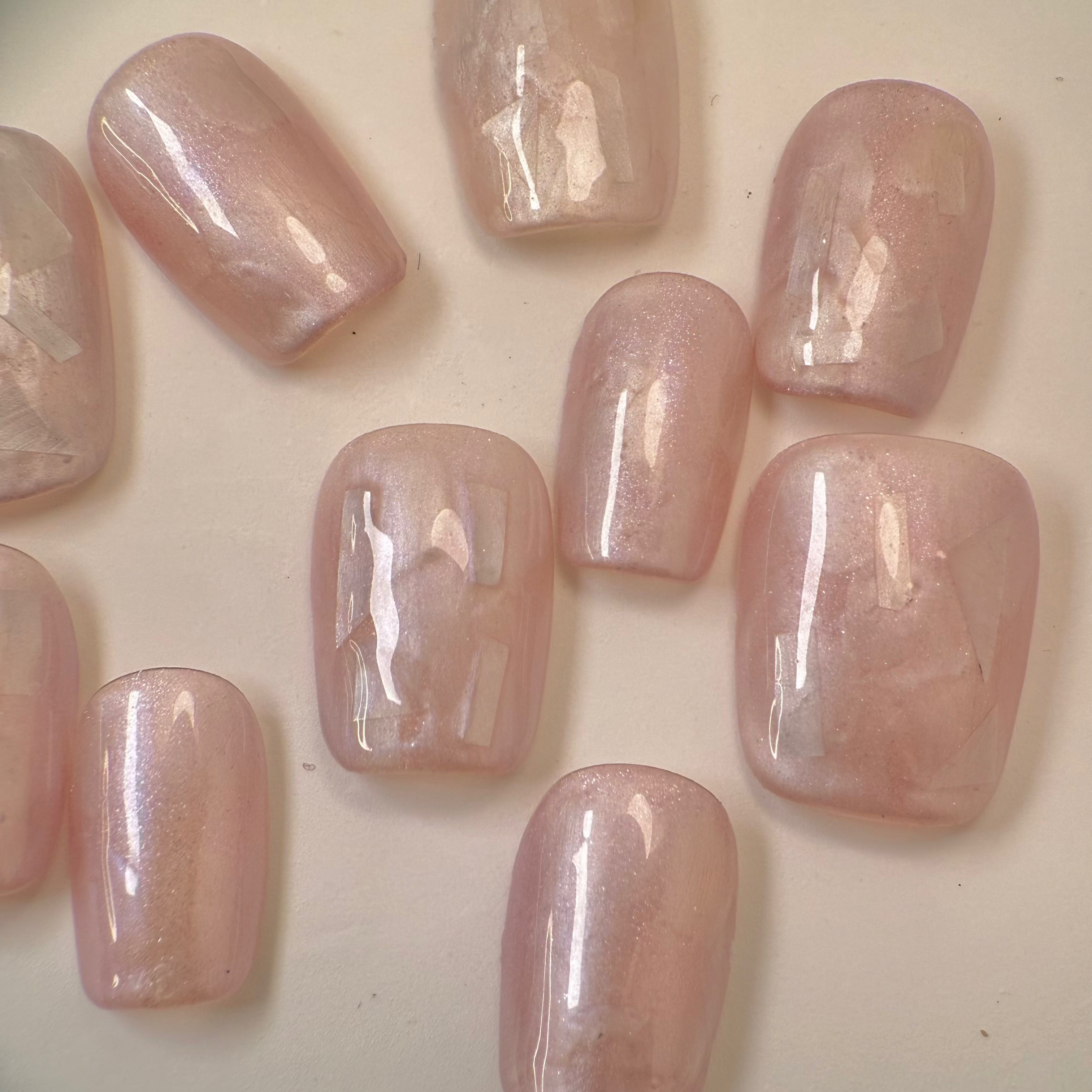 Handmade silver cat-eye press-on nails with shimmering magnetic effect, Vlei Nails Cape Town South Africa.