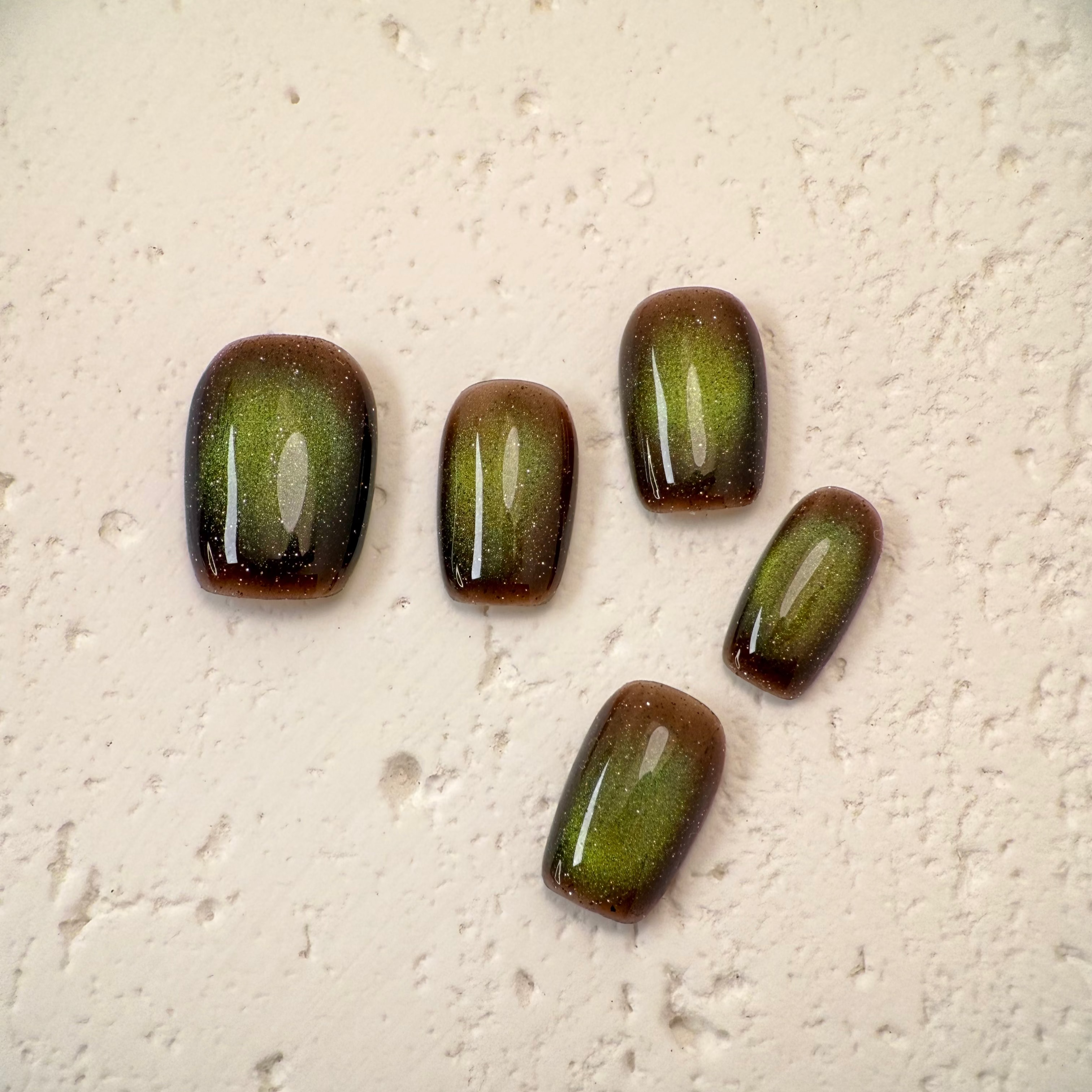 Handmade deep mocha cat-eye press-on nails with magnetic shimmer, Vlei Nails Cape Town South Africa.