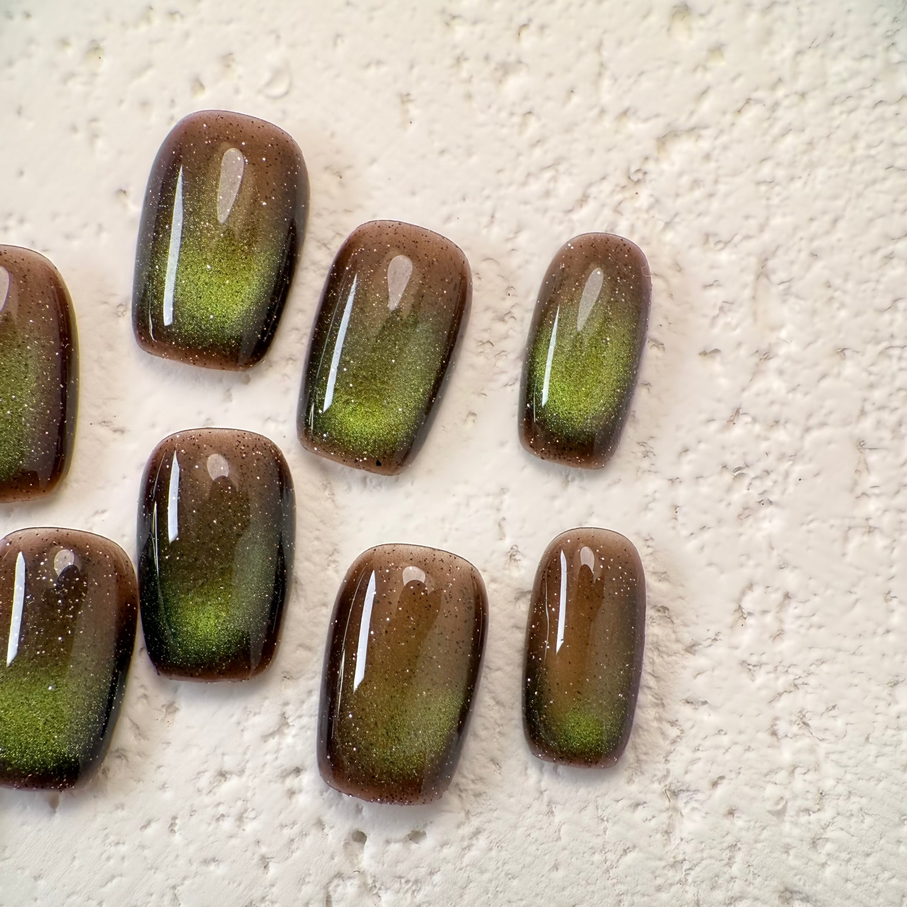 Handmade deep mocha cat-eye press-on nails with magnetic shimmer, Vlei Nails Cape Town South Africa.