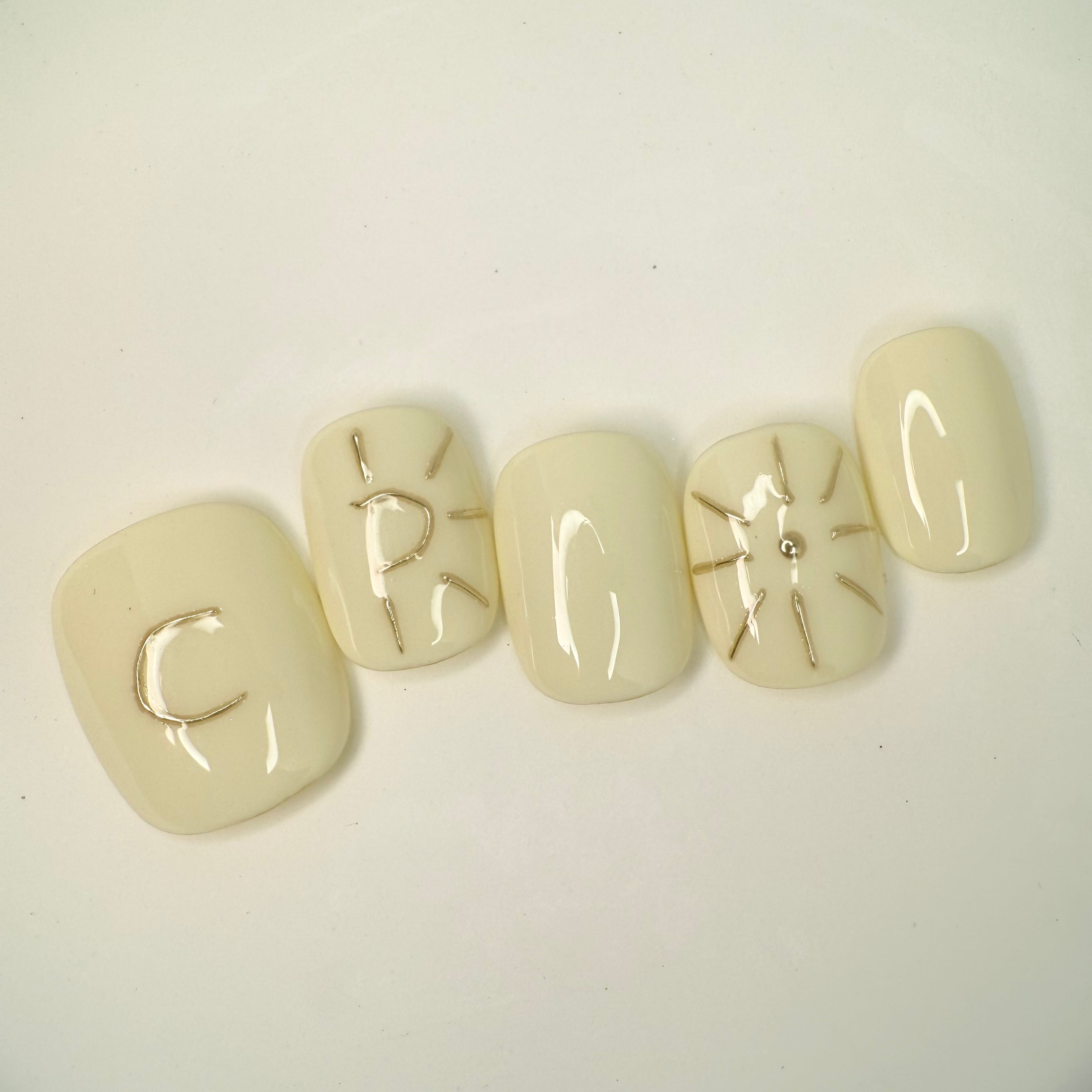 Handmade press-on nails featuring moon and star details