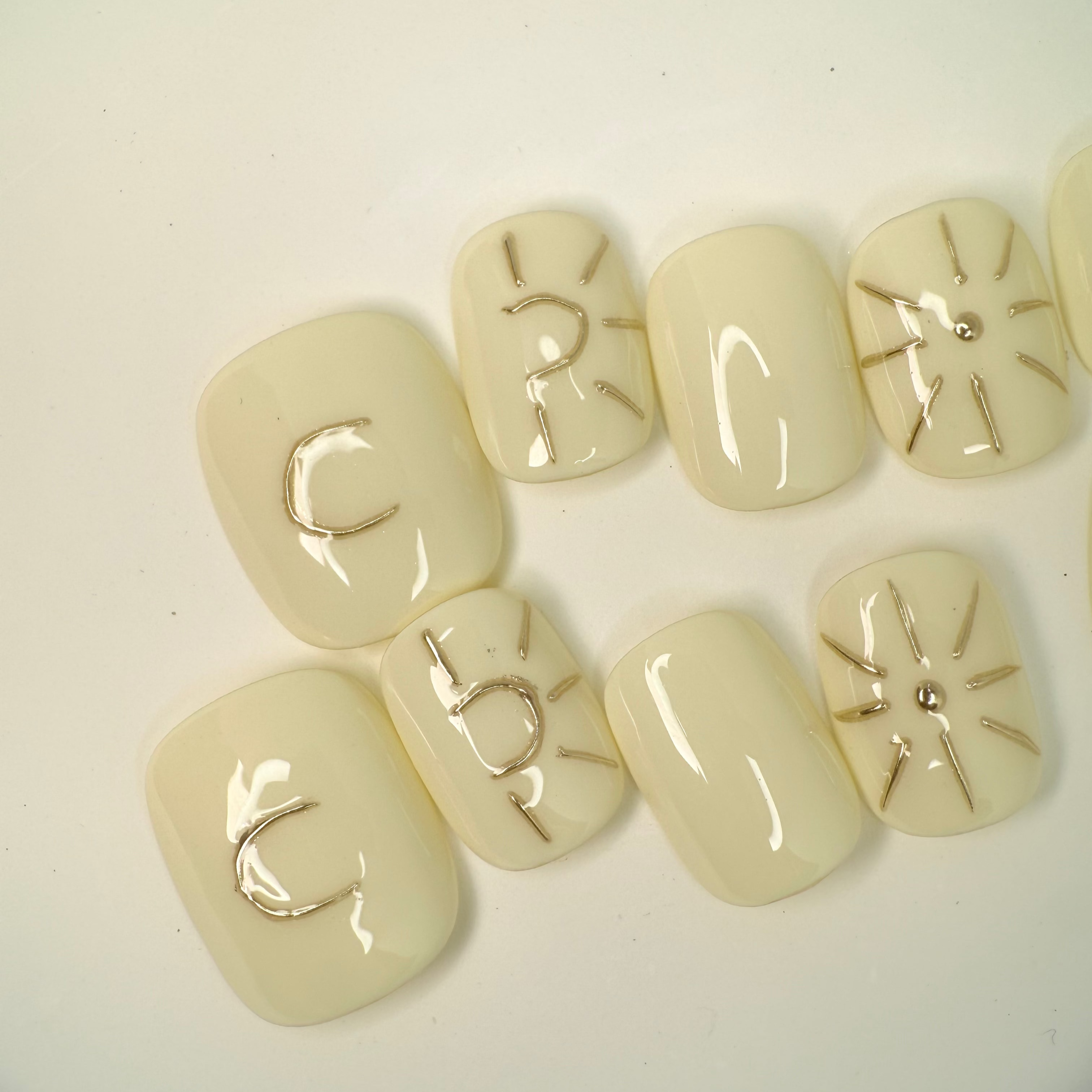 Handmade press-on nails featuring moon and star details