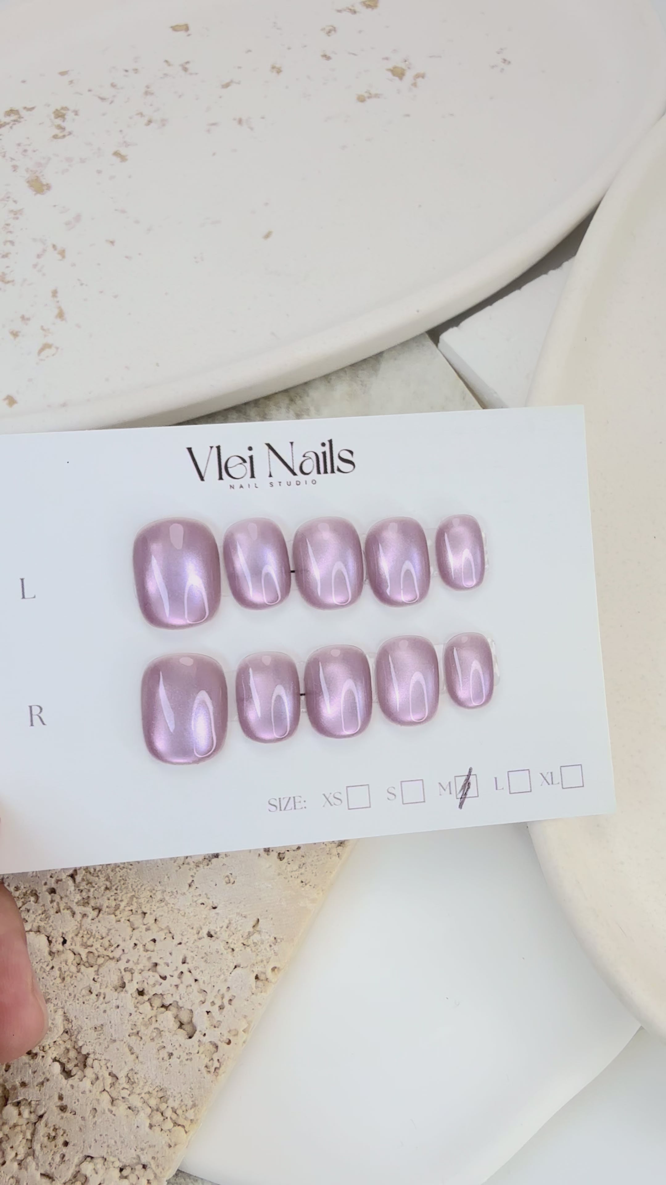 Pink Mist cat eye press-on nails in soft pastel pink with magnetic shimmer