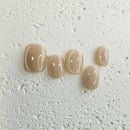 Handmade champagne-toned press-on nail set with silky shine