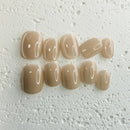 Handmade champagne-toned press-on nail set with silky shine