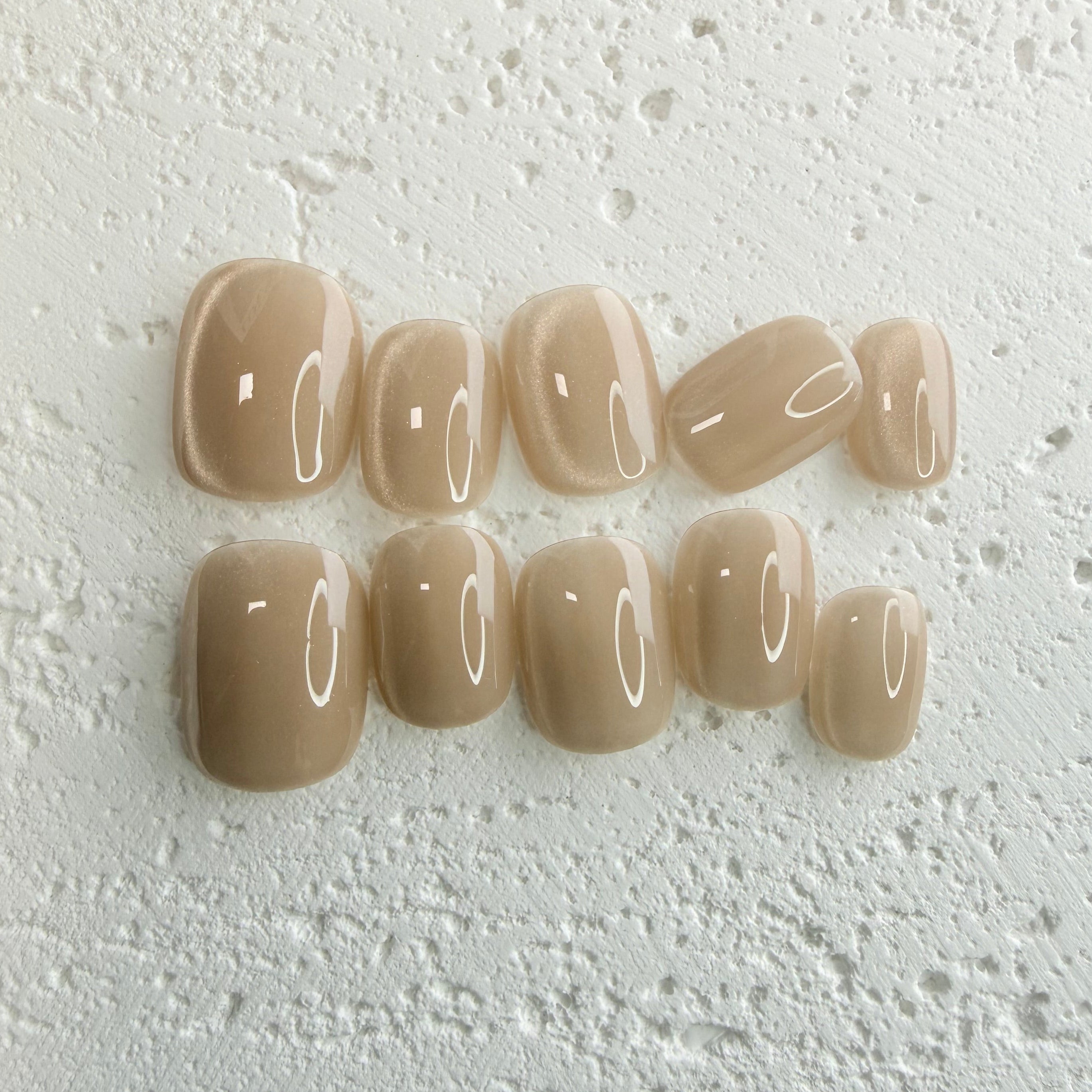 Handmade champagne-toned press-on nail set with silky shine