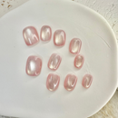 Rose Starlight cat eye press-on nails with soft pink shimmer and magnetic glow