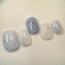 Handmade round golden cat-eye press-on nails with shimmering magnetic effect, Vlei Nails Cape Town.