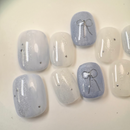 Handmade round golden cat-eye press-on nails with shimmering magnetic effect, Vlei Nails Cape Town.
