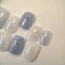 Handmade round golden cat-eye press-on nails with shimmering magnetic effect, Vlei Nails Cape Town.