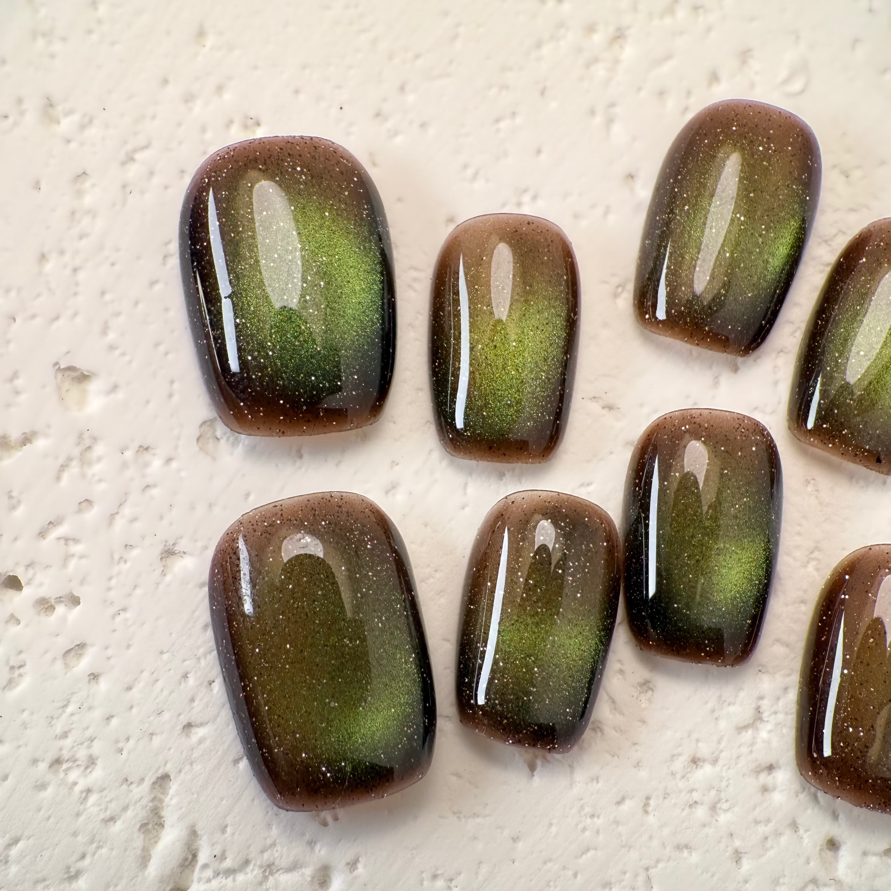 Handmade deep mocha cat-eye press-on nails with magnetic shimmer, Vlei Nails Cape Town South Africa.