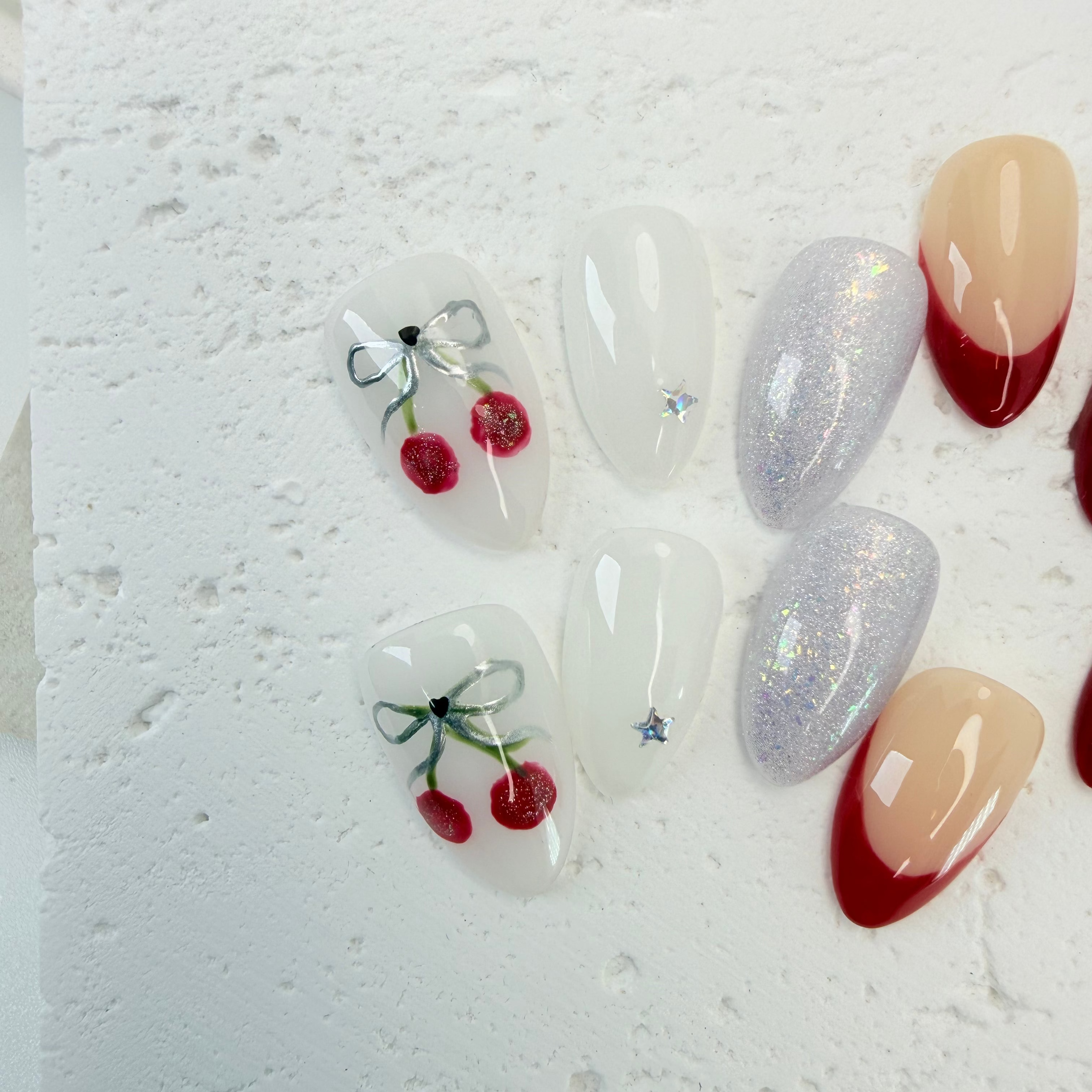 Pink cat-eye press-on nails with glossy shimmer, handcrafted by Vlei Nails Cape Town.
