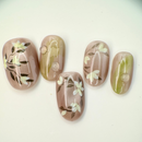 Handcrafted frosted pink and silver press-on nails with metallic shine, and soft pastel tones – made by Vlei Nails Cape Town.
