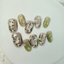 Handcrafted frosted pink and silver press-on nails with metallic shine, and soft pastel tones – made by Vlei Nails Cape Town.
