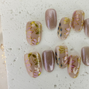 Handcrafted nude pink and gold cat-eye press-on nails with 3D gold line accents – made by Vlei Nails Cape Town.
