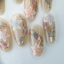 Handcrafted blush nude press-on nails with pearl flowers and gold shimmer lines – made by Vlei Nails Cape Town.
