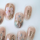 Handcrafted ivory white press-on nails with 3D pearl flowers and gold shimmer – made by Vlei Nails Cape Town.

