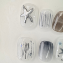 Grey cat-eye press-on nails with gold line accents, handcrafted by Vlei Nails Cape Town.
