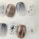 Grey cat-eye press-on nails with gold line accents, handcrafted by Vlei Nails Cape Town.
