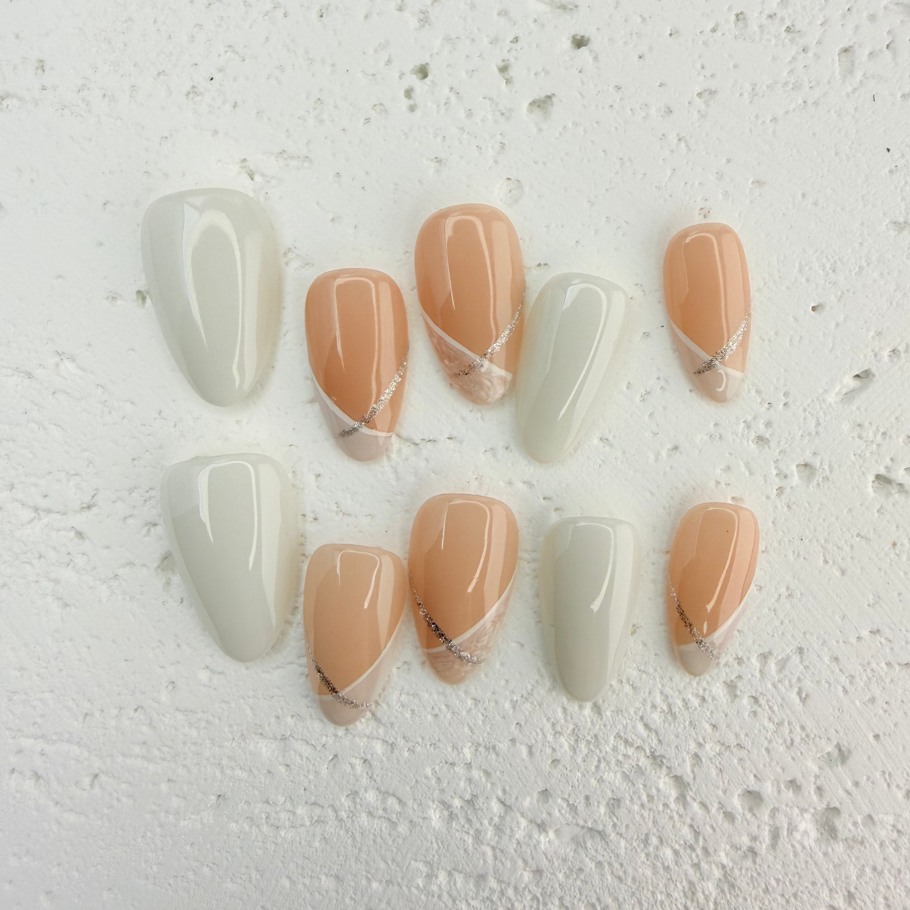 Pink and white French press-on nails with a soft, romantic finish, handcrafted by Vlei Nails Cape Town.
