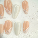 Pink and white French press-on nails with a soft, romantic finish, handcrafted by Vlei Nails Cape Town.
