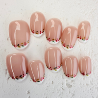 Christmas-themed French press-on nails with white tips and subtle shimmer, elegant handmade holiday nails by Vlei Nails.
