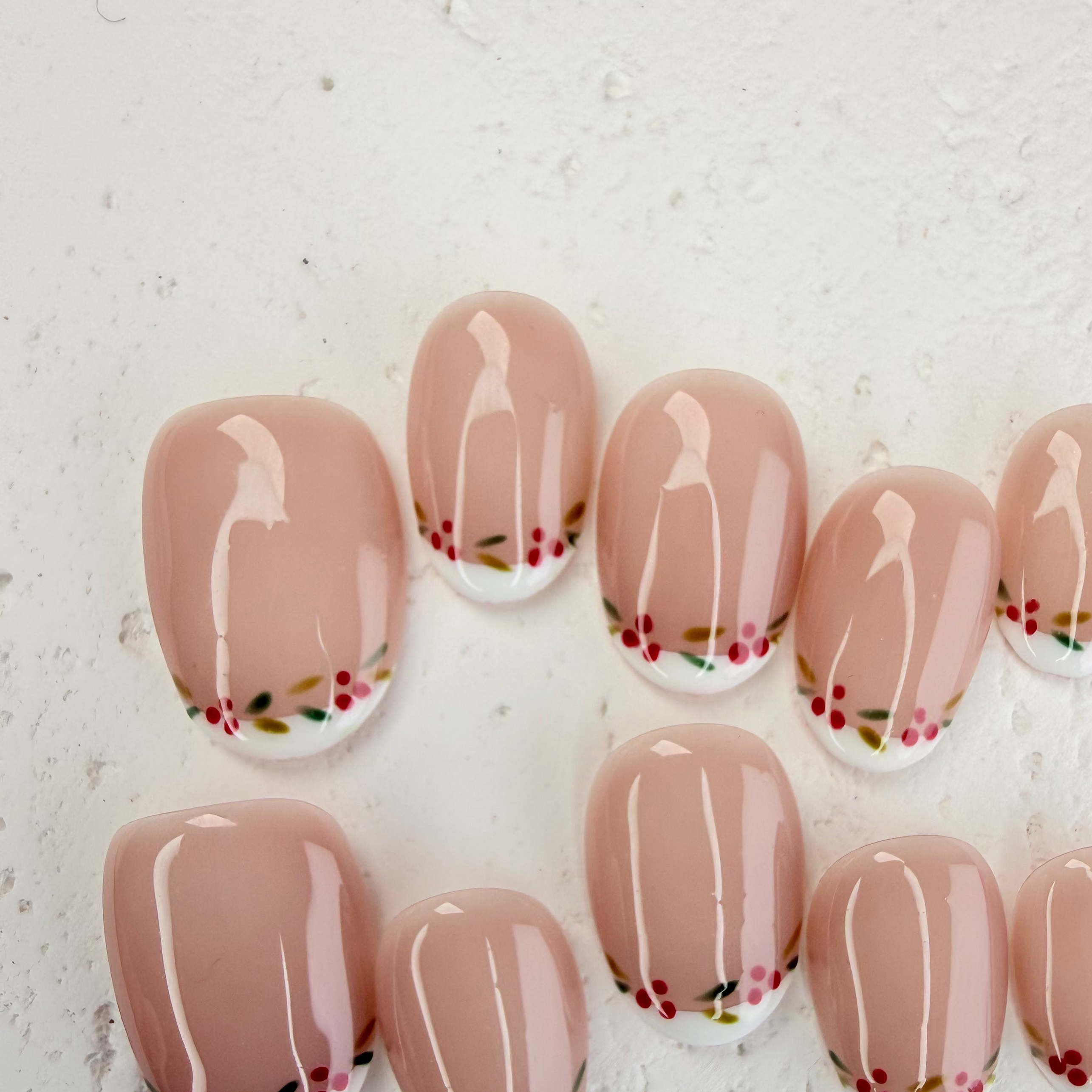 Christmas-themed French press-on nails with white tips and subtle shimmer, elegant handmade holiday nails by Vlei Nails.
