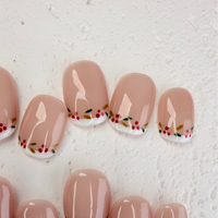 Christmas-themed French press-on nails with white tips and subtle shimmer, elegant handmade holiday nails by Vlei Nails.
