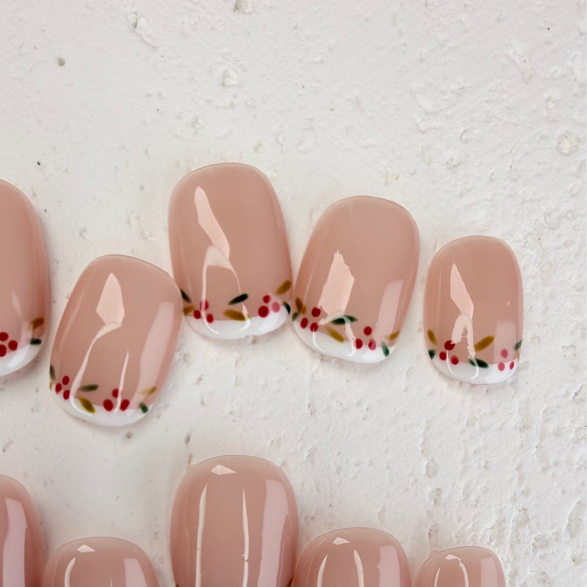 Christmas-themed French press-on nails with white tips and subtle shimmer, elegant handmade holiday nails by Vlei Nails.
