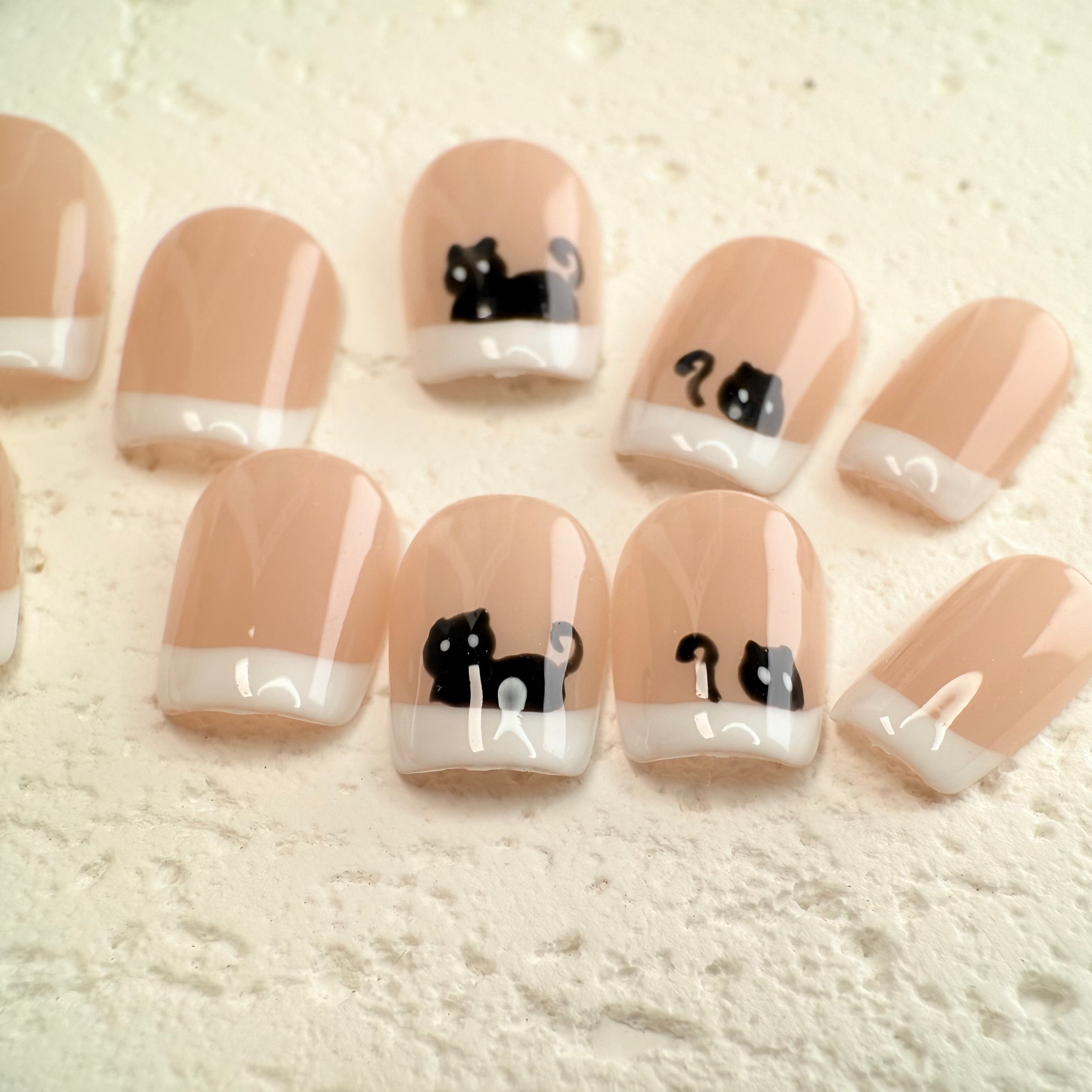 Cat French press-on nails with cute kitty details and white French tips