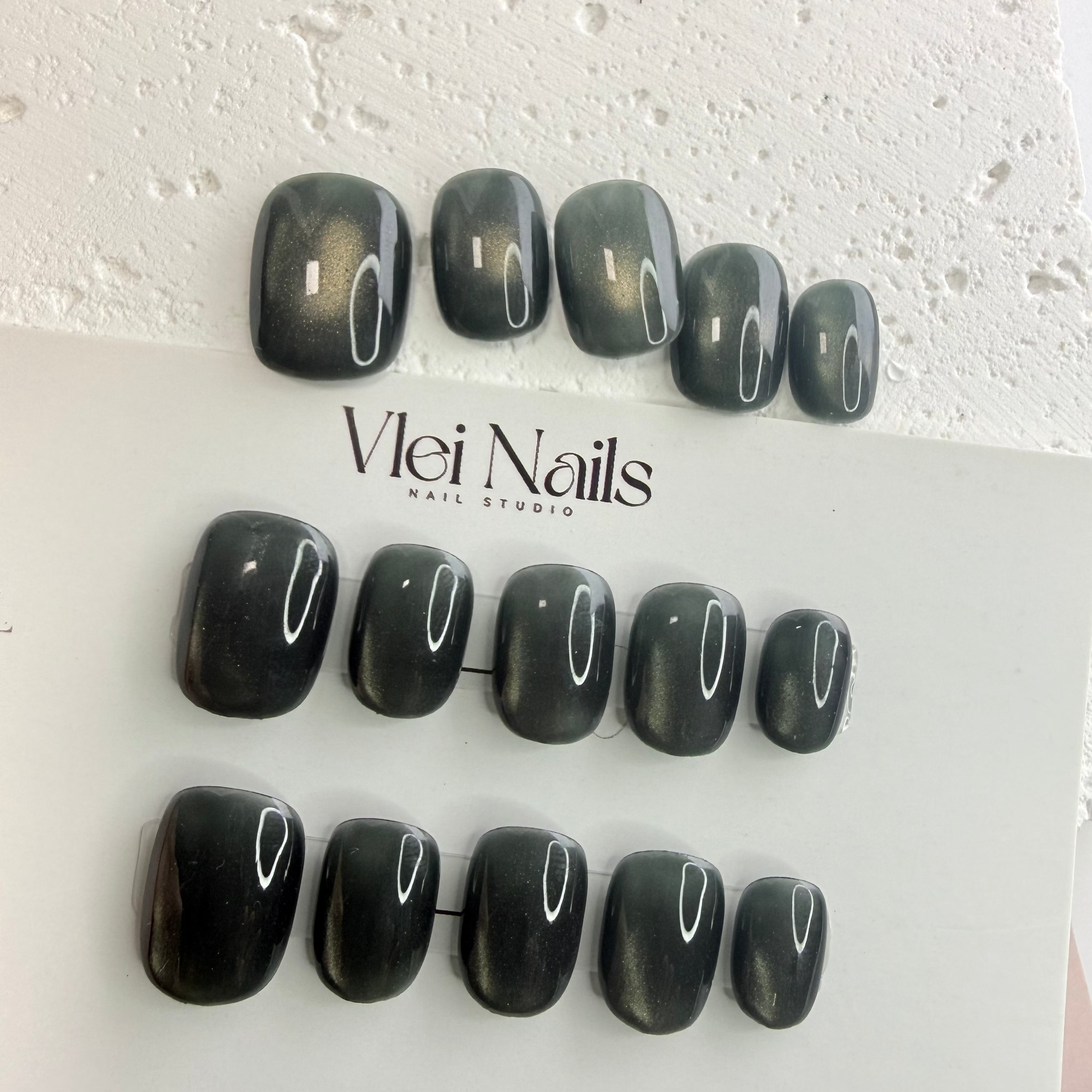 Handmade olive-green press-on nail set with an earthy minimalist style
