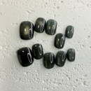 Handmade olive-green press-on nail set with an earthy minimalist style