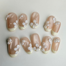 Frosted French milky-white press-on nails with frosted finish and embossed leaf texture.
