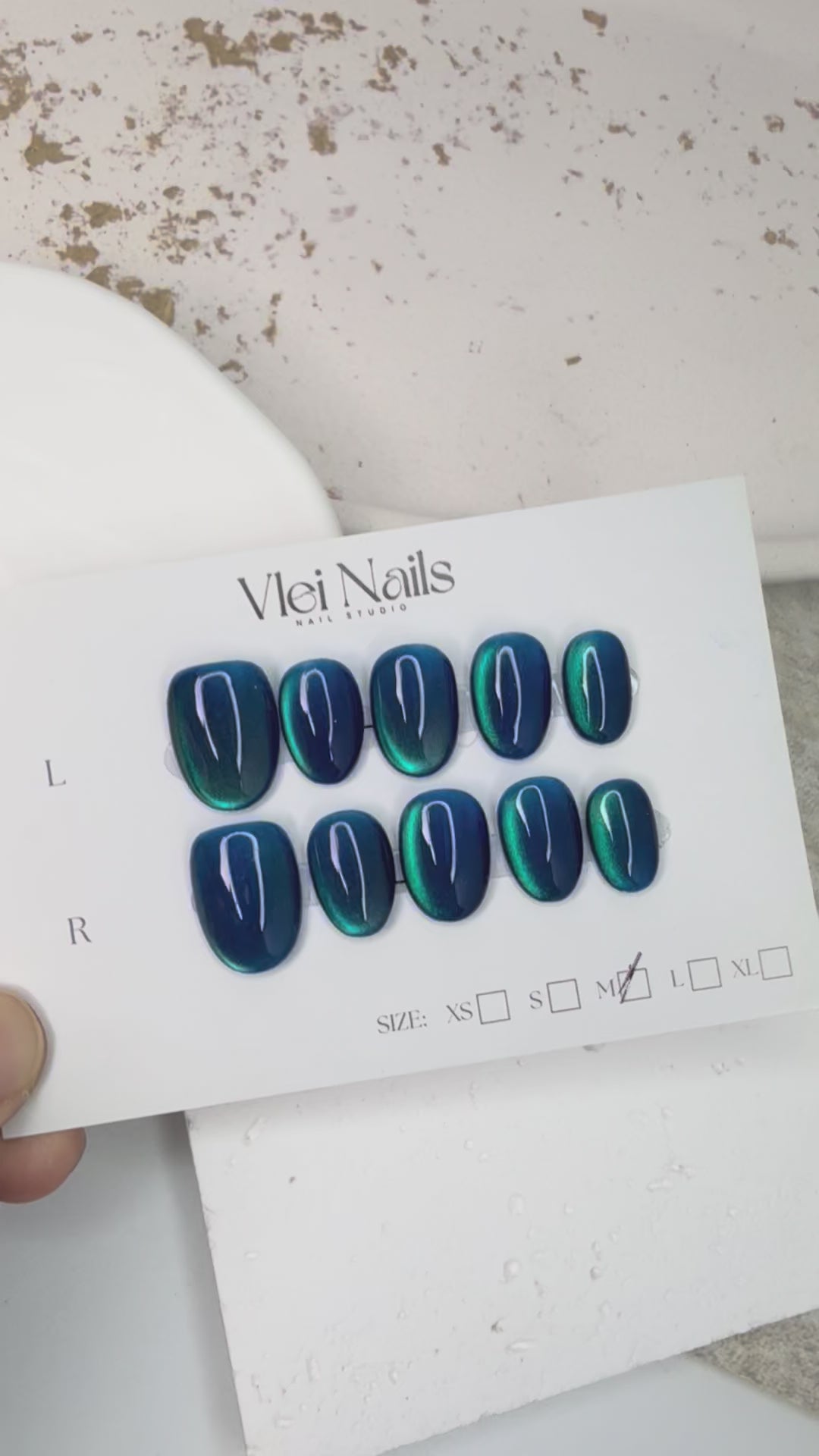 Handmade midnight blue press-on nails with glossy gel finish
