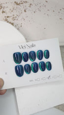 Handmade midnight blue press-on nails with glossy gel finish
