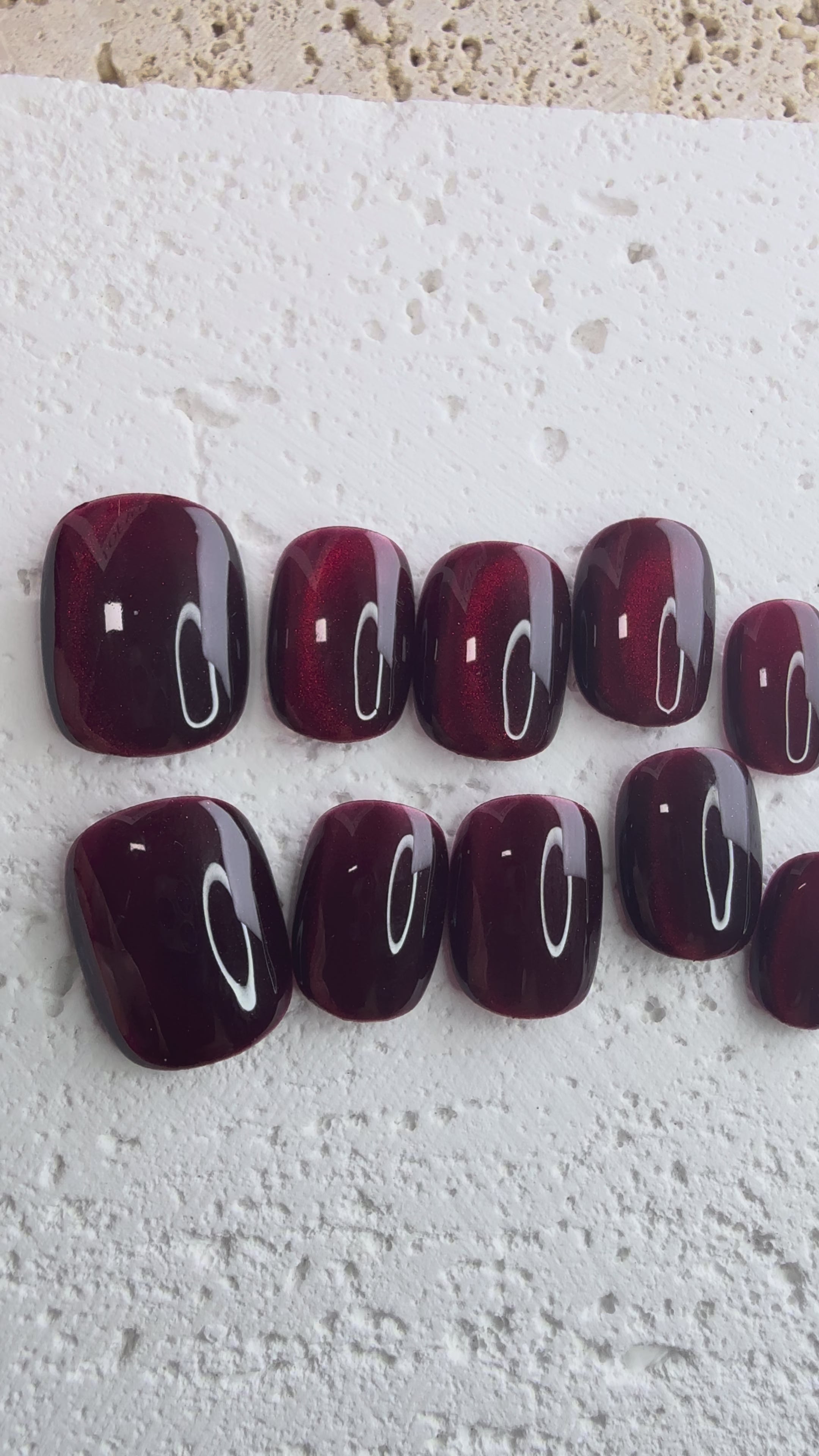 Handmade deep red press-on nail set with a jewel-like shine