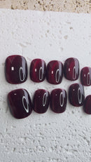 Handmade deep red press-on nail set with a jewel-like shine