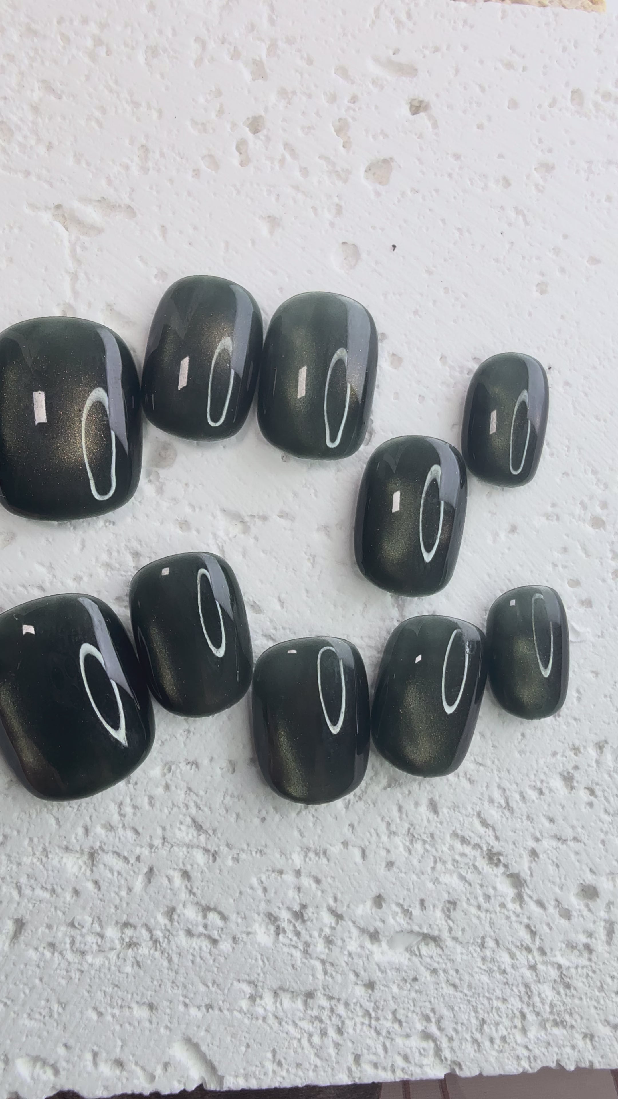 Handmade olive-green press-on nail set with an earthy minimalist style