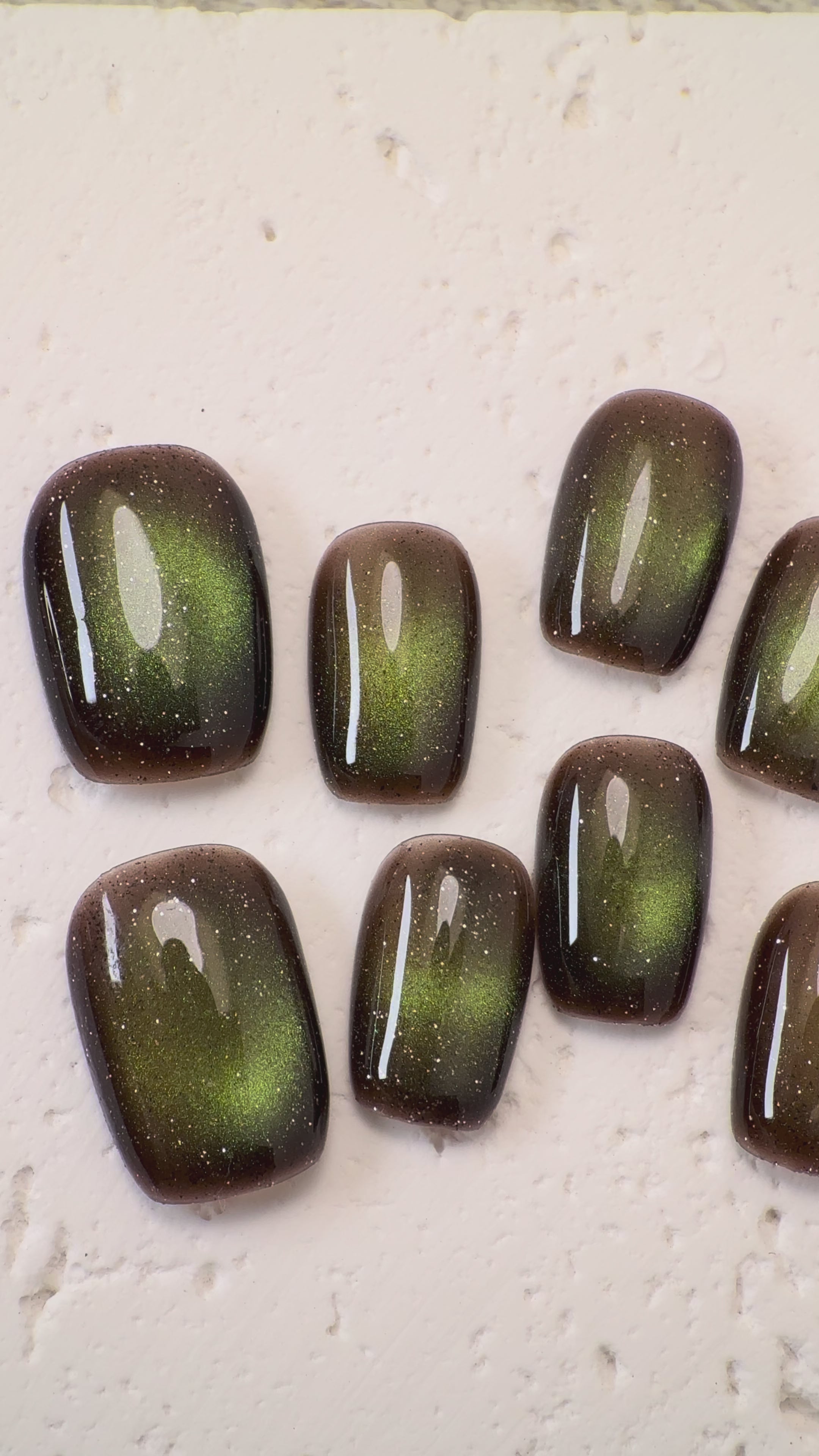 Handmade deep mocha cat-eye press-on nails with magnetic shimmer, Vlei Nails Cape Town South Africa.