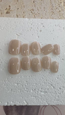 Handmade champagne-toned press-on nail set with silky shine